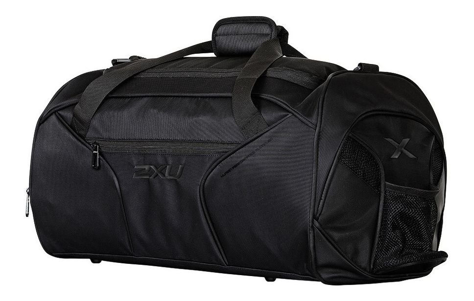 2XU&reg; Gym Bag :: Engineered to meet all gym demands, this 2XU&reg; Gym Bag features an adjustable strap with shoulder padding to ensure comfort and versatility. With protective studs on the bottom, this Bag is the ultimate workout companion to store all essentials. Complete with multiple zipped pockets, water bottle holder and inner shoe compartment, this Bag offers secure and accessible storage.   This web exclusive item ships separately within the continental U.S. only. You can count on this item to ship in 3-5 business days!